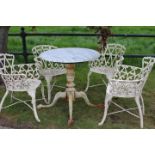 Set of four decorative cast iron garden arm chairs.