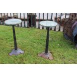 Pair of Art Deco style cast iron tables.