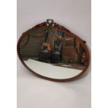 Late 19th. C. mahogany oval mirror.