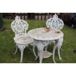 Three piece decorative cast iron garden set.