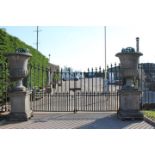 Pair of exceptional quality limestone urns on plinths.