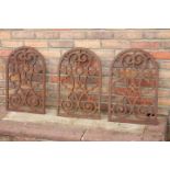 Three cast iron open work arched panels.