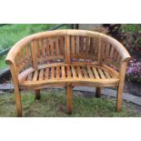 Two seater teak garden bench.