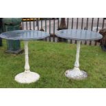 Pair of Art Deco style cast iron tables with marble tops.