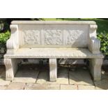 Pair of decorative cast stone three seater benches.