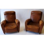 Pair of 1940's leather upholstered club chairs.