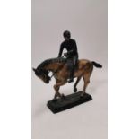 Jockey and bronze on plinth.