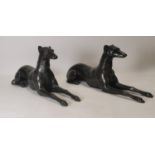 Pair of bronze models of reclining whippets.