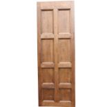 Eight panelled oak door.