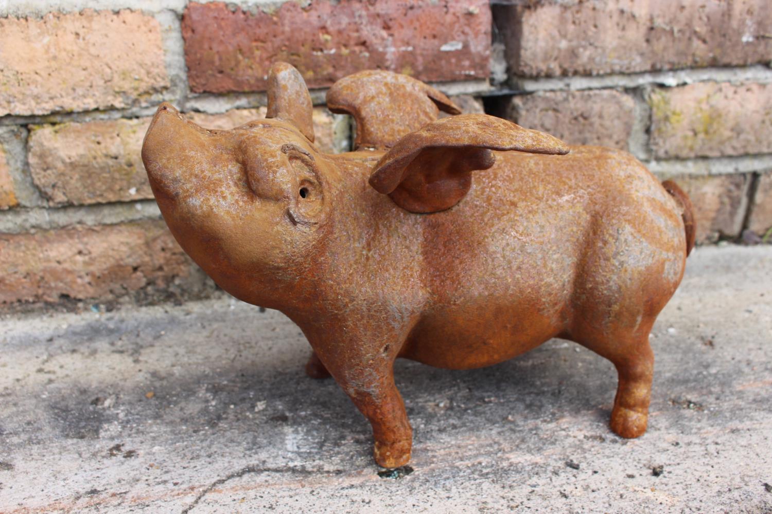 Cast iron pig door stop.