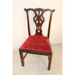 Carved mahogany chair in the Irish Chippendale style.