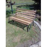Wrought iron and wooden garden bench.