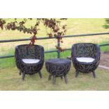 Black and gold rattan three piece garden set including two chairs.