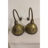 Pair of brass swan neck wall lights.