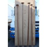 Collection of four oak pillars.