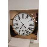 Large contemporary copper framed wall clock.