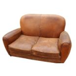 Leather upholstered two seater couch.