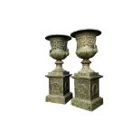 Pair of exceptional quality cast iron urns.