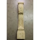Carved wooden column decorated with acanthus leaf.