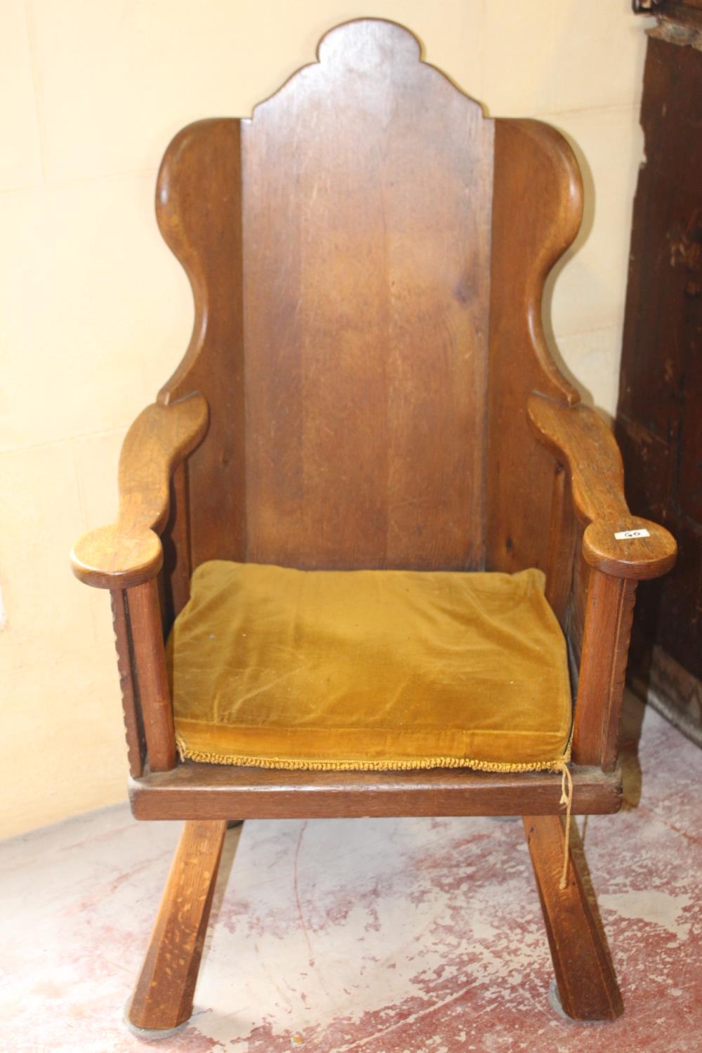 Late 19th C. oak wing back arm chair.