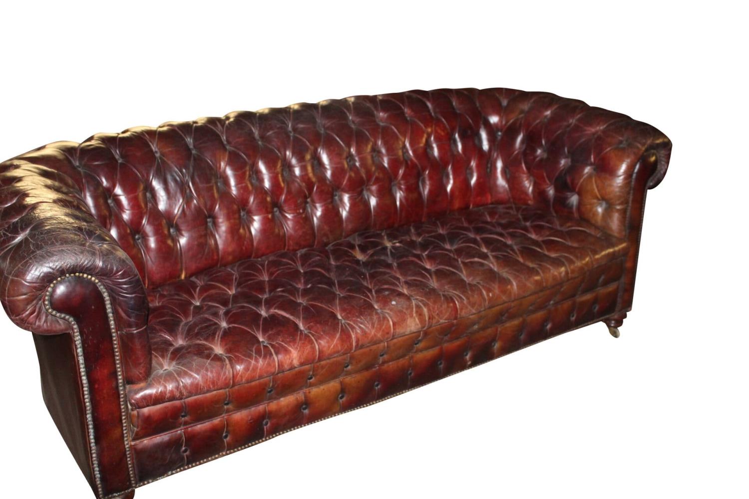 Early 20th C. deep buttoned leather chesterfield sofa.