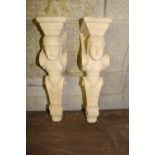 Pair of carved wooden corbels in the form of women.