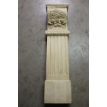 Carved wooden column with floral decoration.