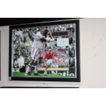 Framed signed David Beckham photo.