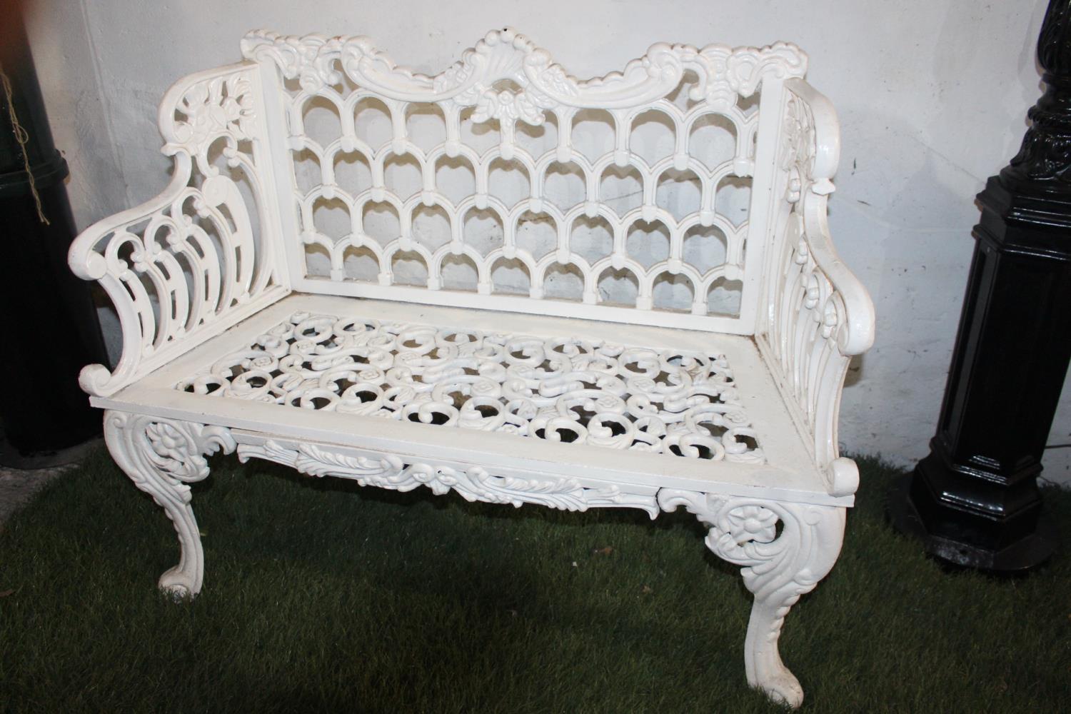 Cast iron two seater garden bench.