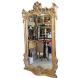 Free standing gilt mirror in the Rocco style.
