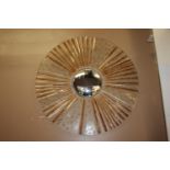 Decorative convex mirror with glass shell frame.