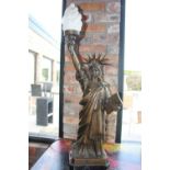 Bronze lamp in the form of the Statue of Liberty.