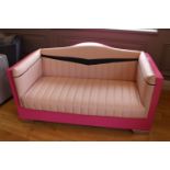 Unusual American style pink upholstered two seater sofa.