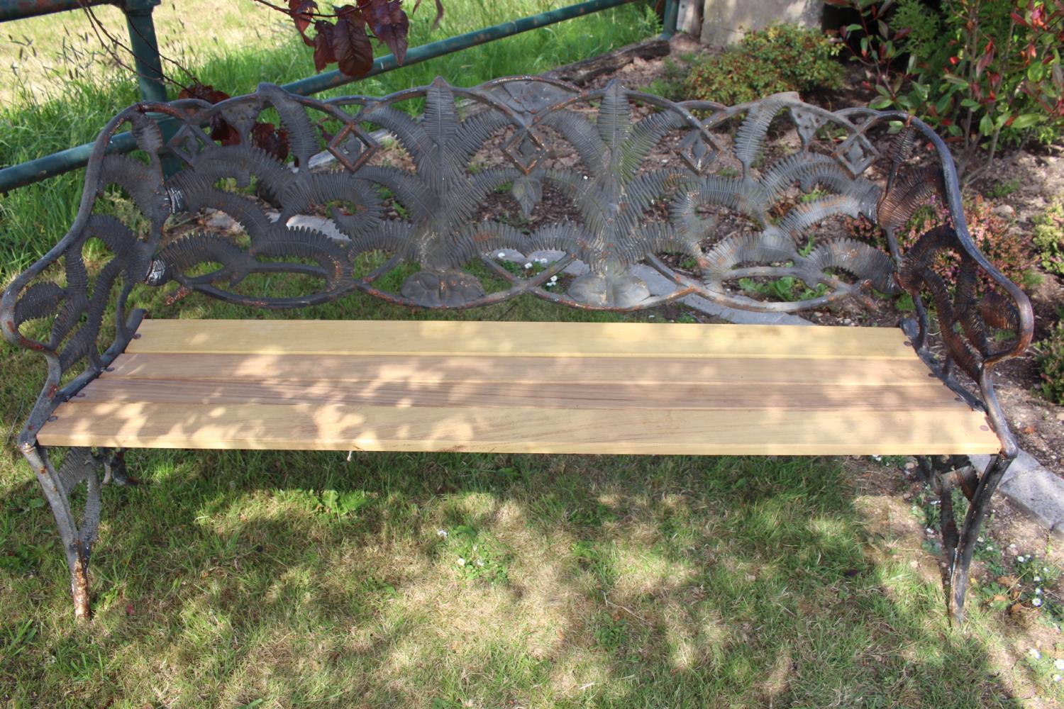 Cast iron three seater garden bench.