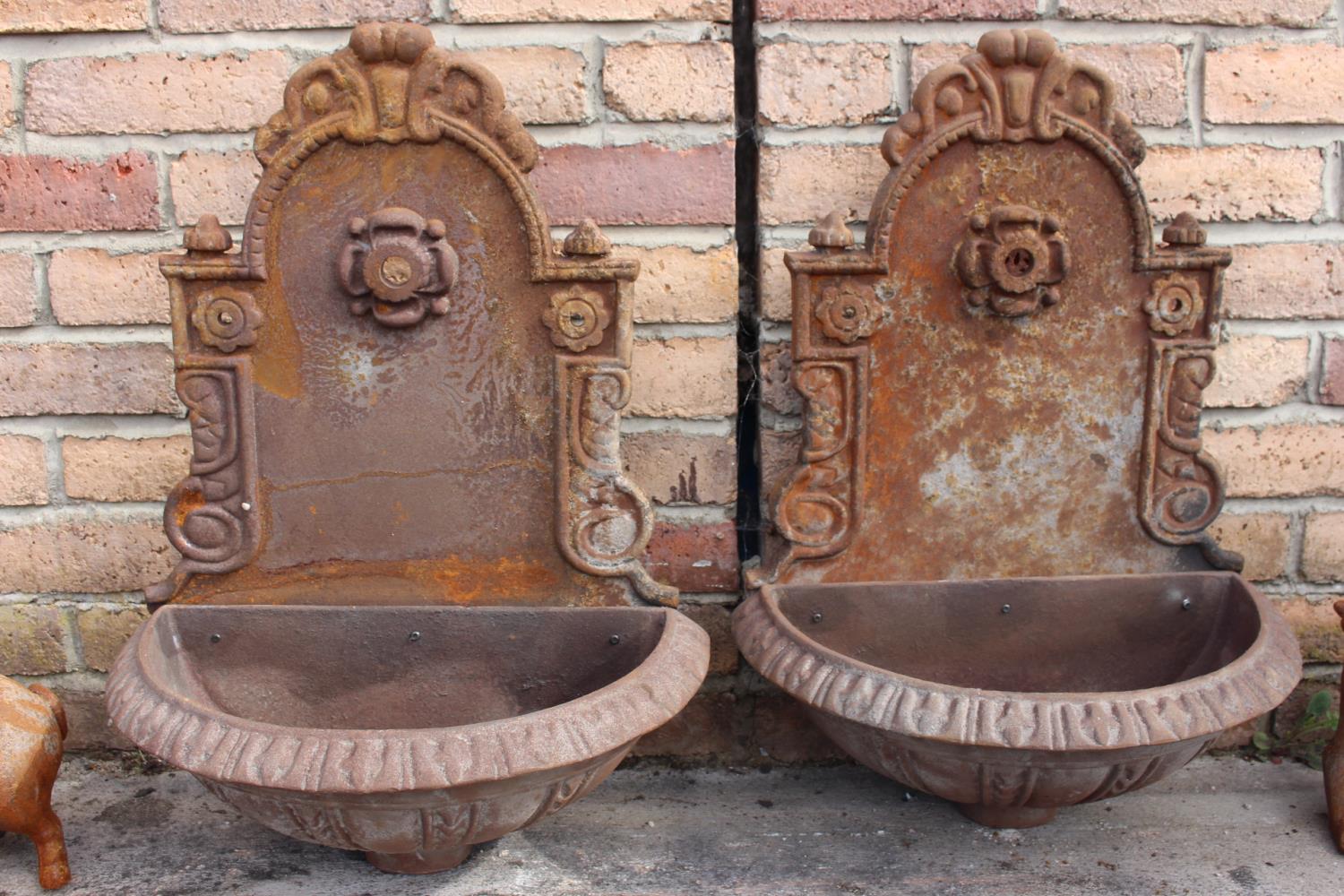 Pair of cast iron garden water fonts.