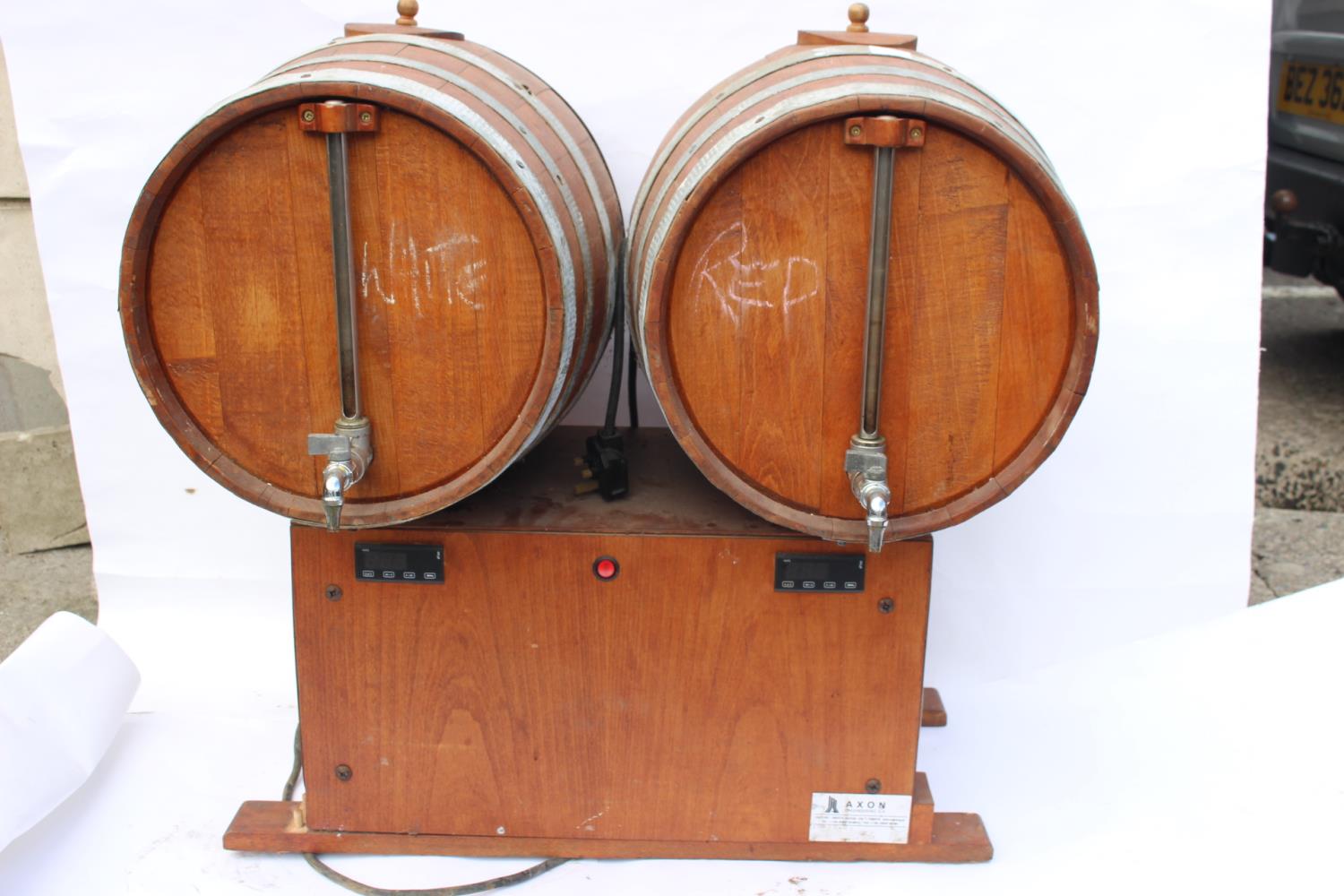 Double barrelled wooden wine dispenser.
