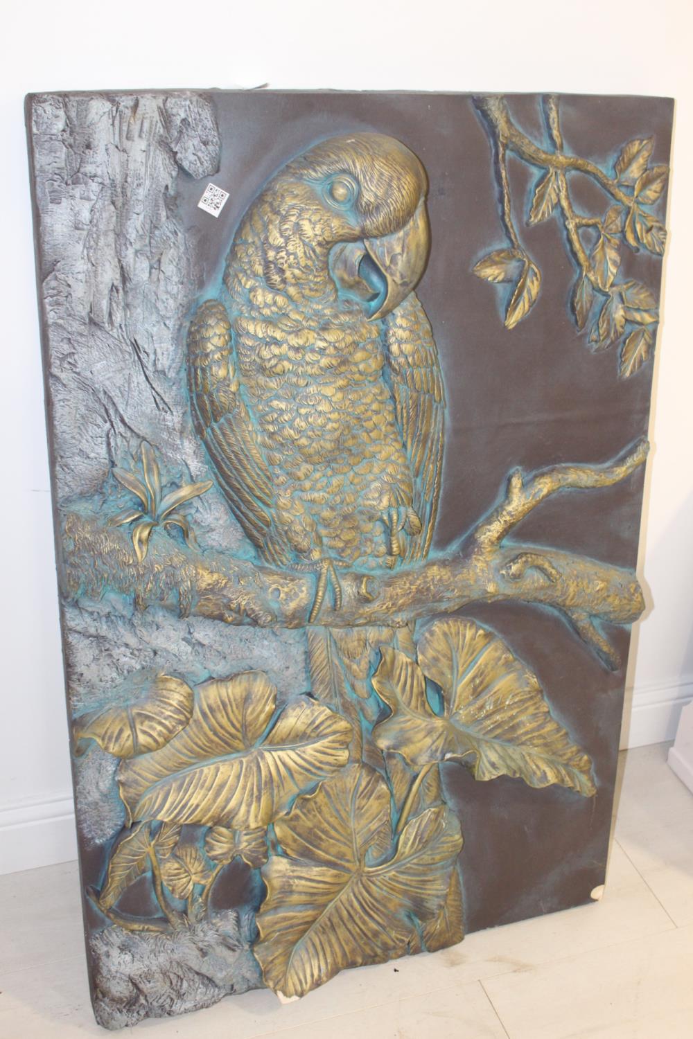 Resin wall plaque depicting a Parrot.