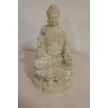 Carved marble effect figure of a Buddha.