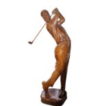 Carved wooden model of a golfer.