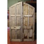 Pair of reclaimed arched panelled pine doors.
