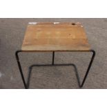 Metal and wood school desk .