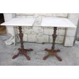 Pair of cast iron garden tables.