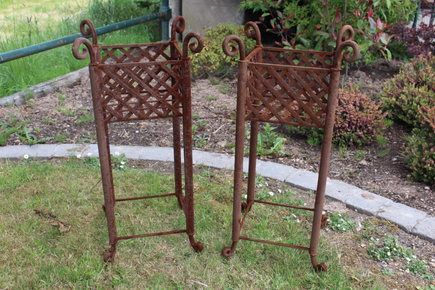 Pair of wrought iron garden planters.