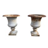 Good quality pair of cast iron garden urns in the Georgian style.