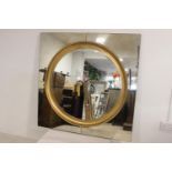 Round gilt wall mirror.