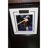 Framed signed Eric Clapton picture.