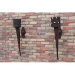 Pair of wrought iron wall torches.