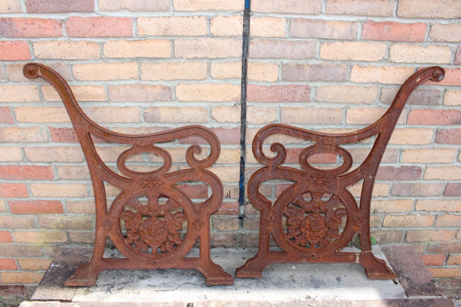 Pair of cast iron garden bench ends.