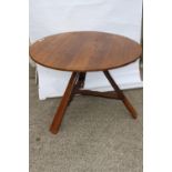 Oak flip top circular table.