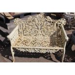 Decorative cast iron two seater garden bench.